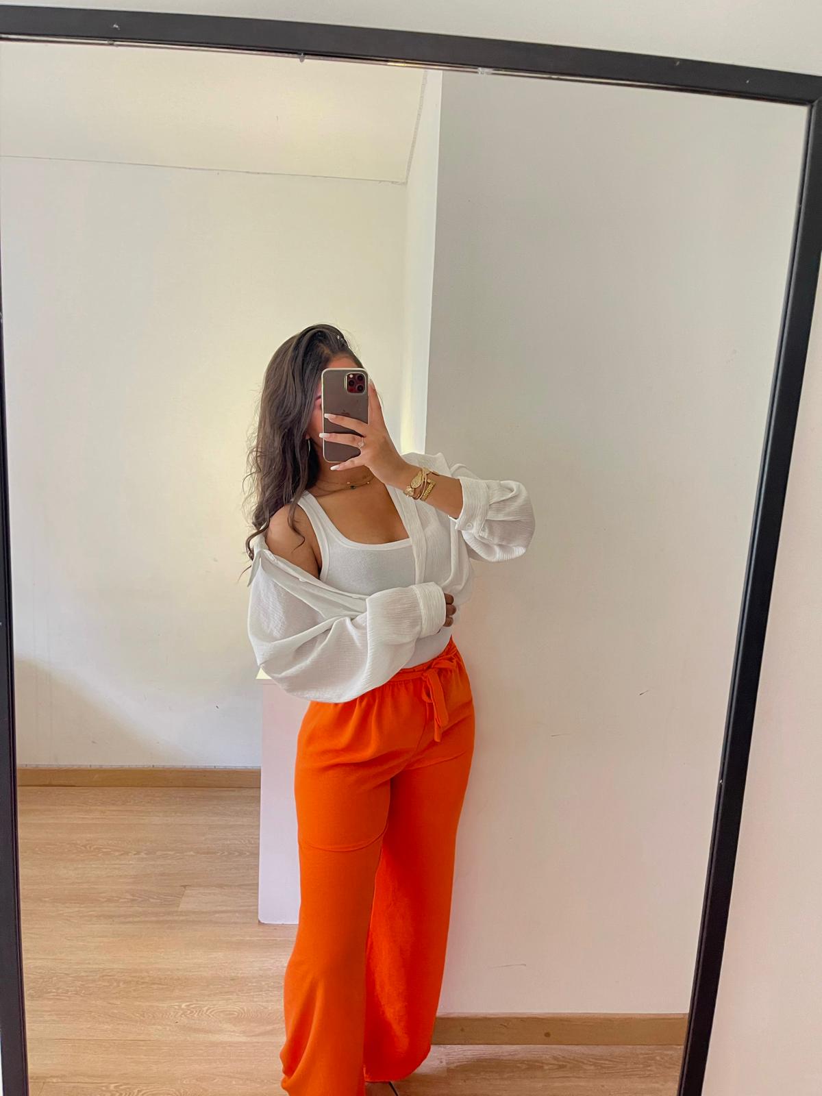Pantalon large orange noué à la taille